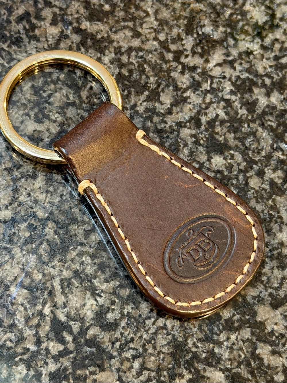 Dooney & Bourke Leather Keychain with Embossed Logo